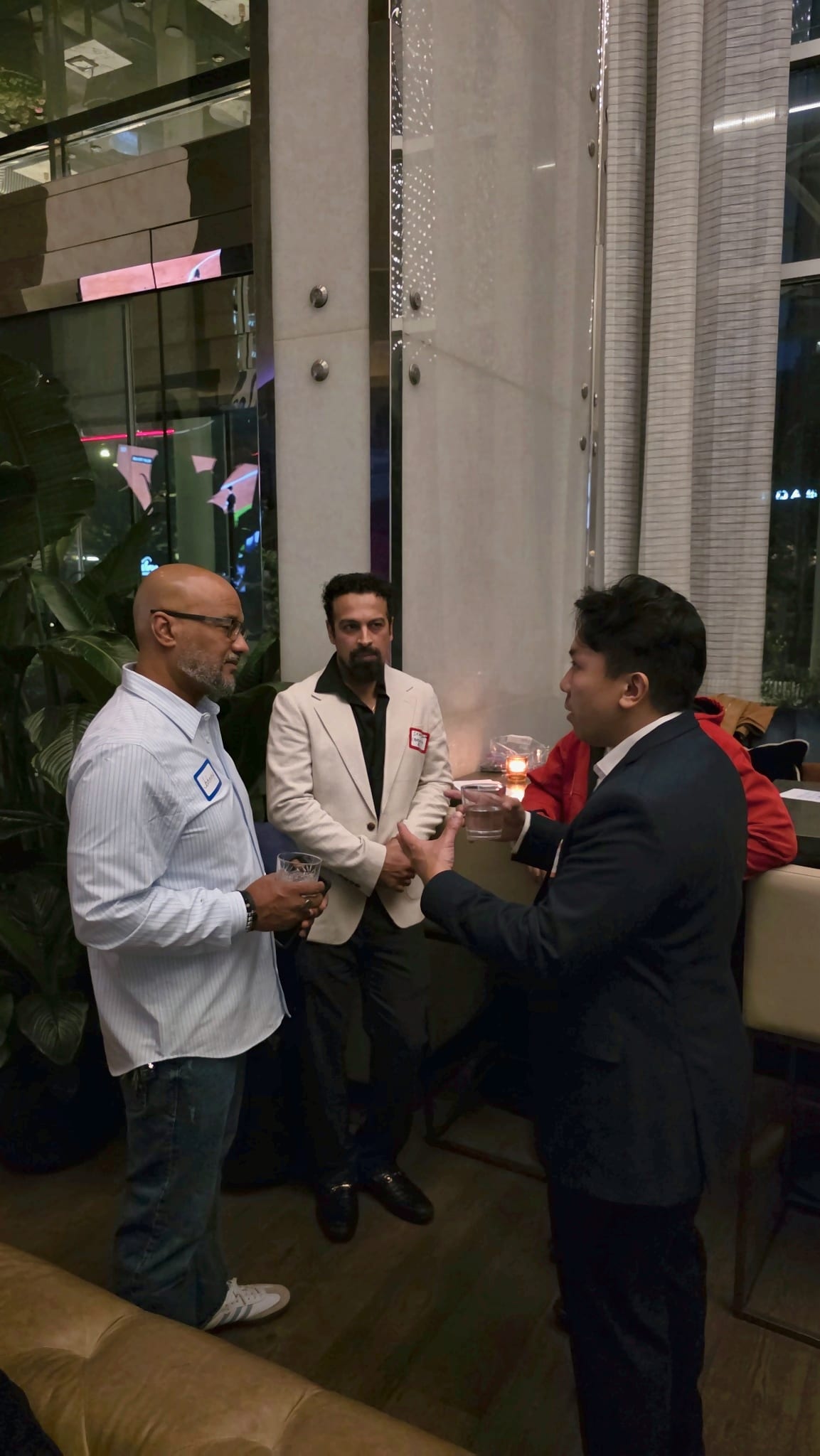 Guests shaking hands and introducing themselves at the Get2Gether networking night