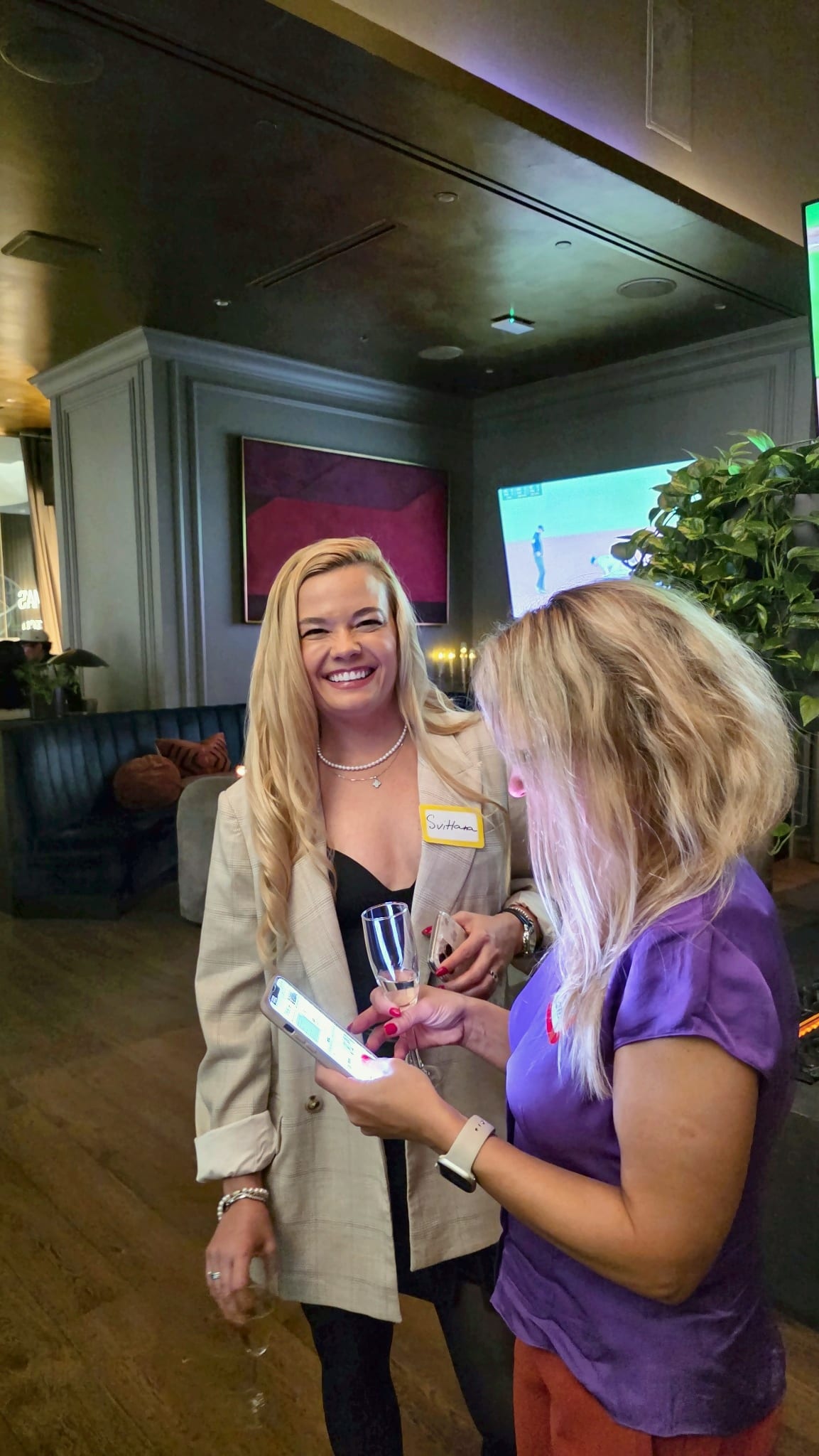 Two guests wearing name badges at the Get2Gether Vancouver business networking night