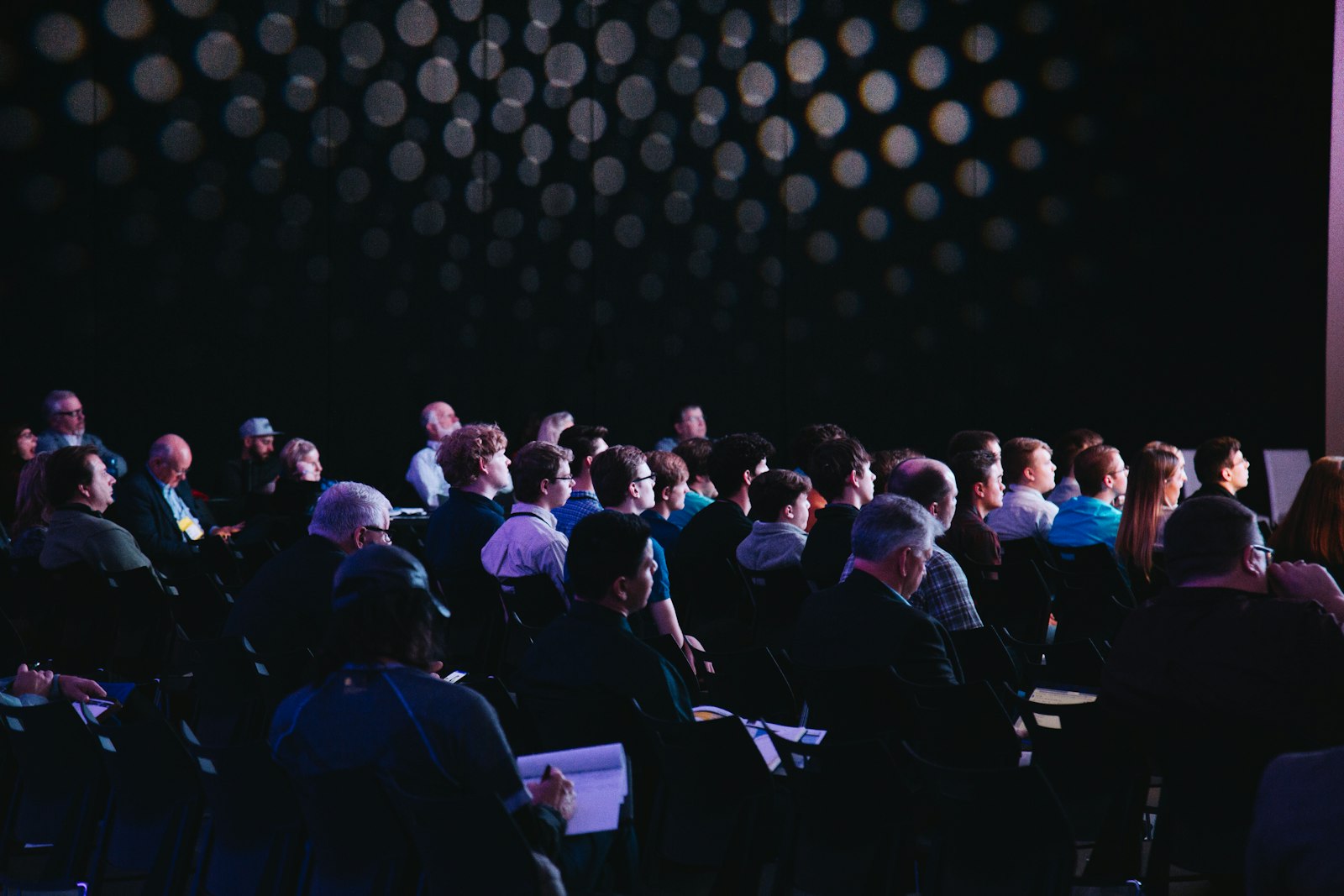 Business networking event in Vancouver — full room of professionals during hosted introductions